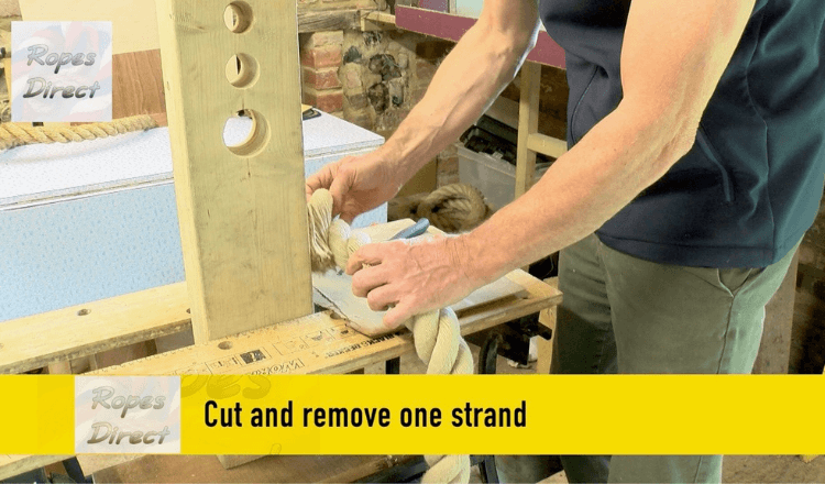 Cutting away a strand to allow rope to pass through hole