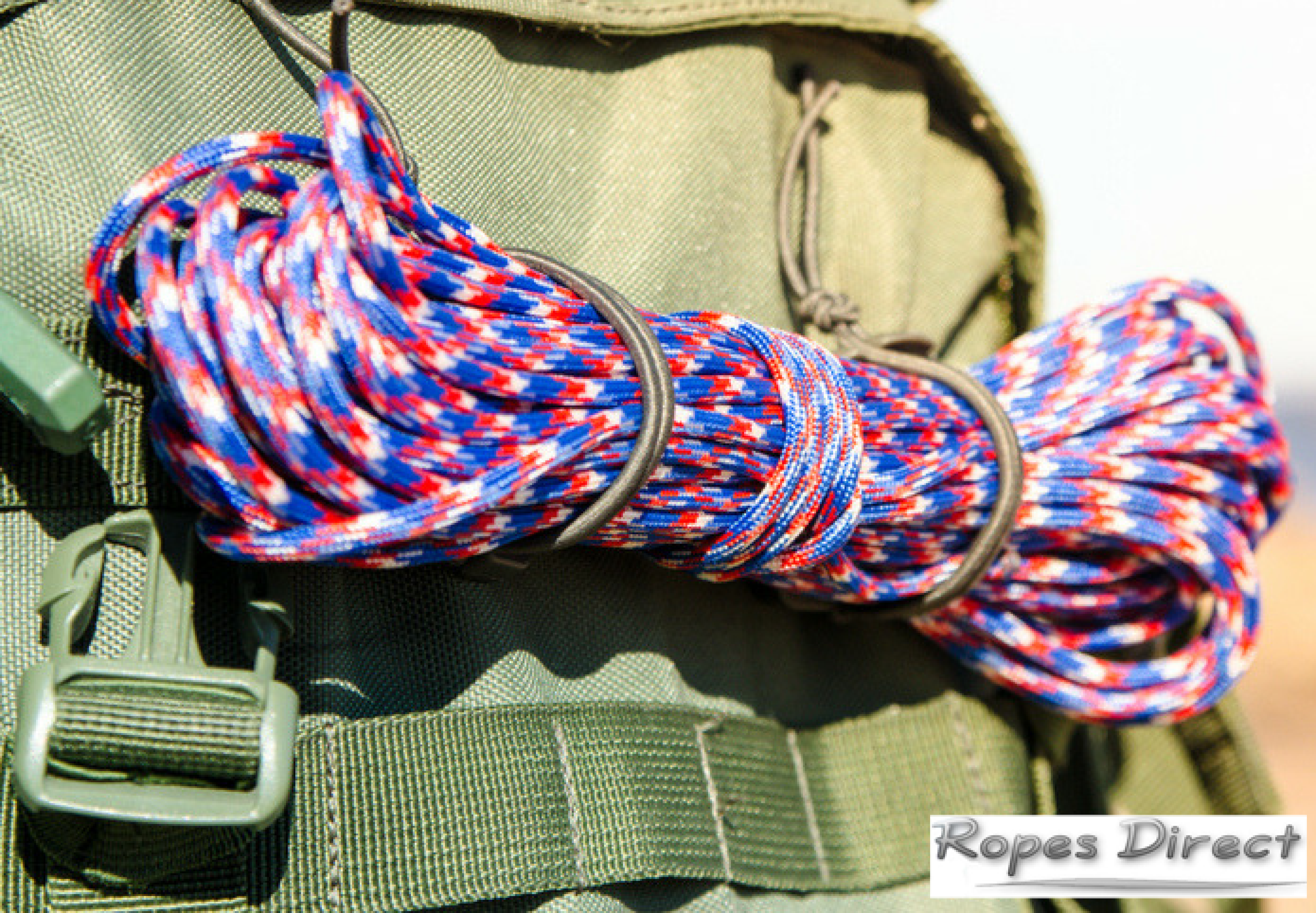 Camper with paracord strapped to their backpack