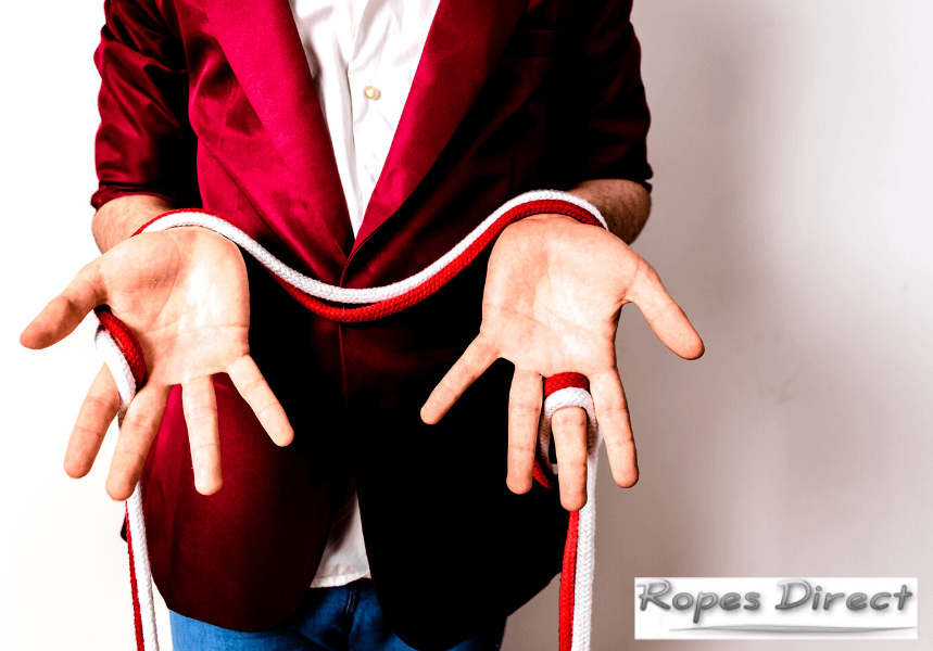 man performing rope magic with magicians rope
