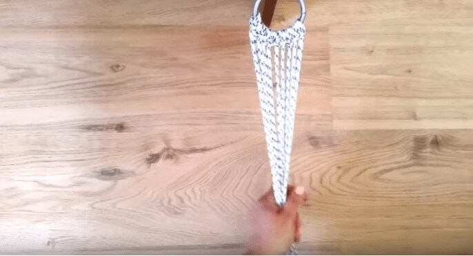 attaching cotton rope to make a rope hammock