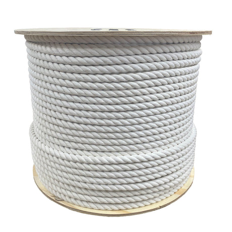A spool of jute rope on a wooden reel on a white background.