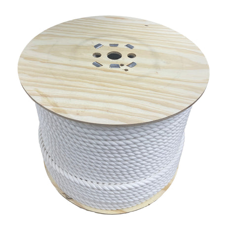 A spool of jute rope on a wooden reel on a white background.