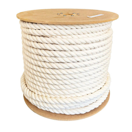 Spool of a cream coloured natural cotton rope on a white background