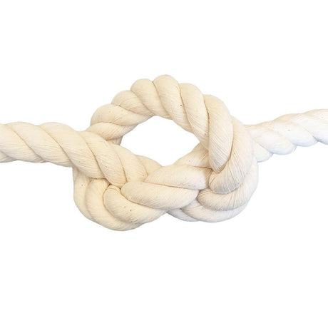 close-up of cream coloured natural cotton rope in a knot on a white background