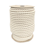 spool of 24mm natural cotton rope on a cardboard reel on a white backgound.