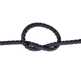 Close-up of a knotted black rope on a white background