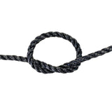 Close-up of a knotted black rope on a white background