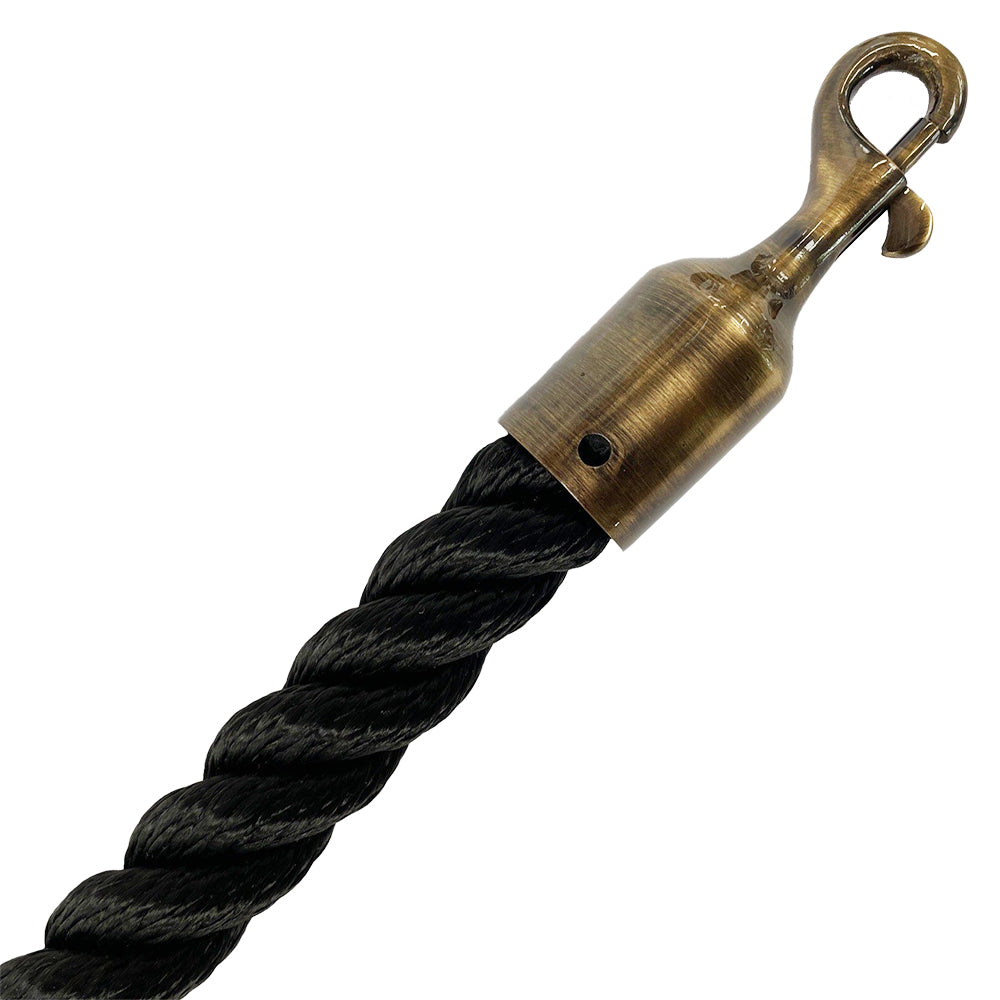 Black rope with a brass hook on a white background