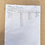 A handwritten size chart on a piece of white paper, titled 'Poly Blue' with columns for 10mm, 12mm, 14mm, and 16mm sizes, placed on a brown cardboard background.