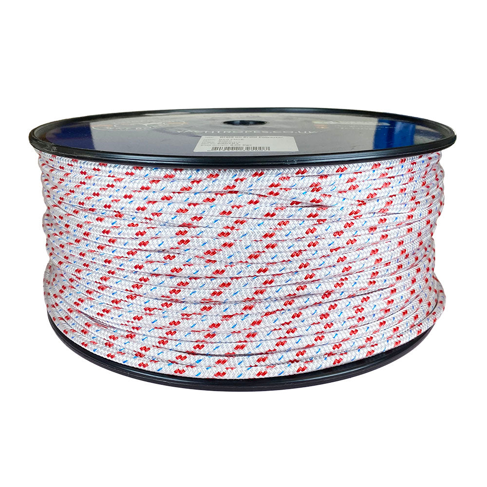 Spool of 6mm white braided polyester with a red fleck on a plastic spool against a white background