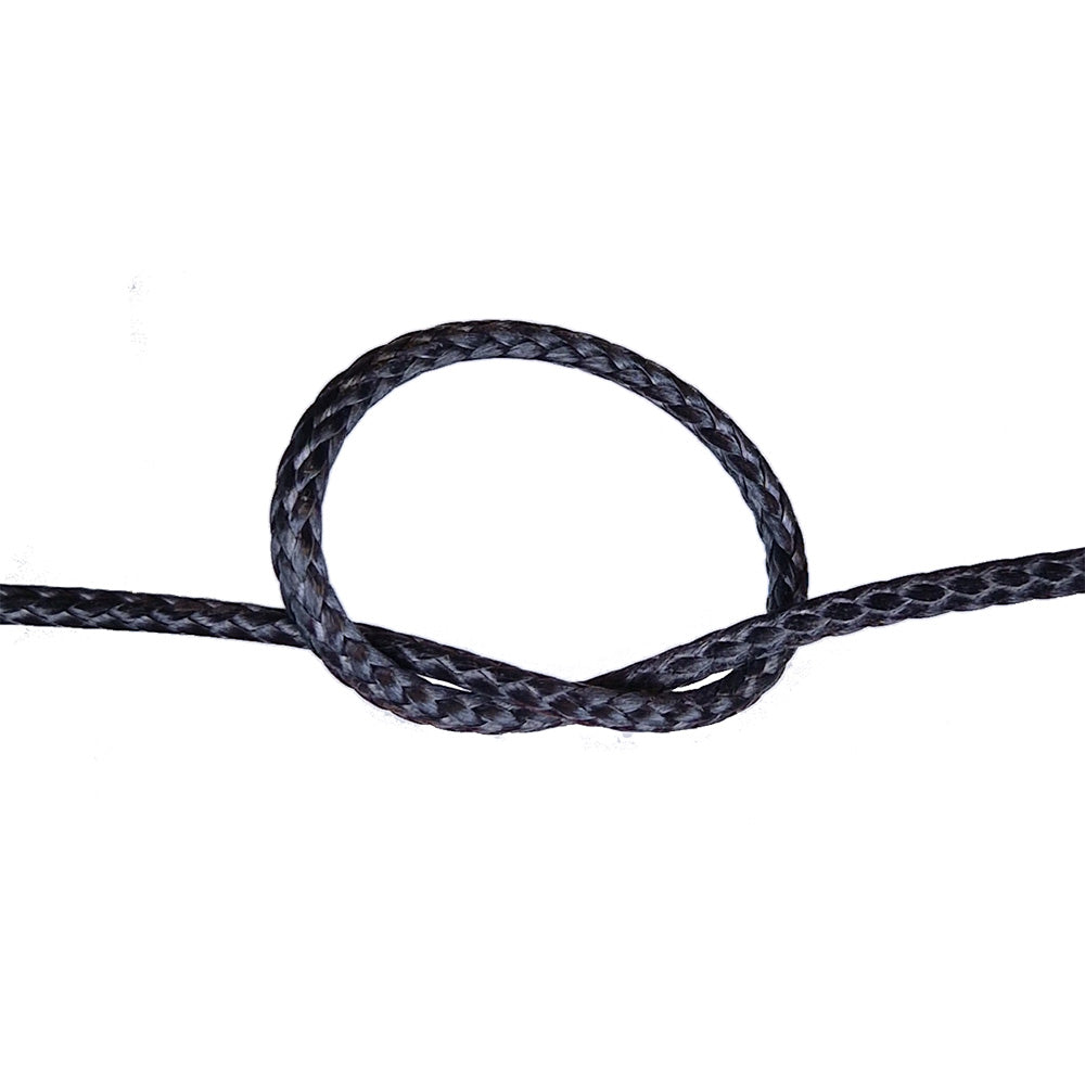 Close-up of a knotted black compact braid rope on a white background