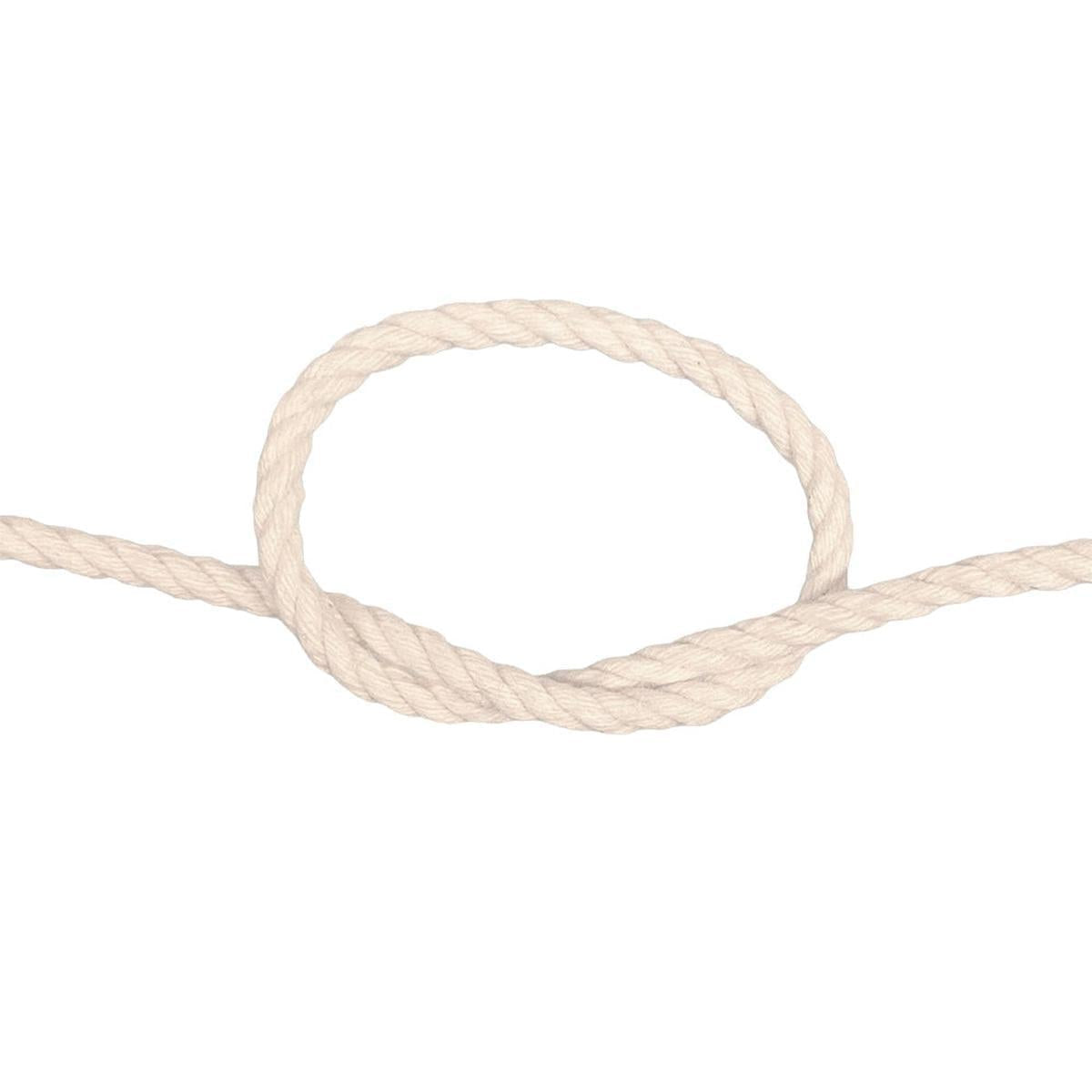 Coiled piece of natural cotton rope on a white background