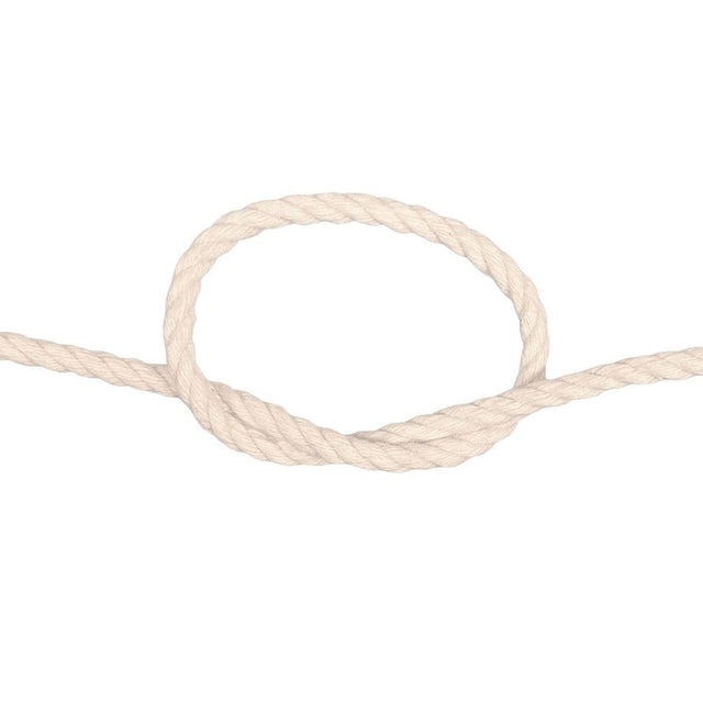 Coiled piece of natural cotton rope on a white background