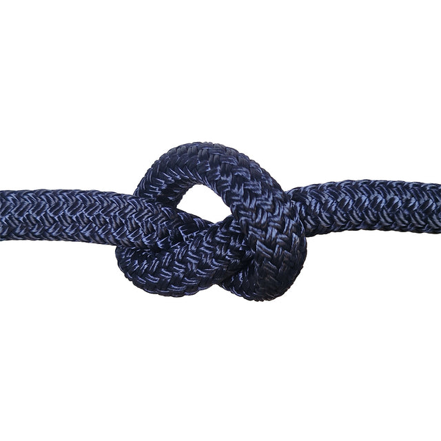 Close-up of a knot of navy blue braided rope on a white background