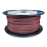 Spool of 4mm red black fleck dyneema braid on a plastic spool with a white background