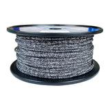 Spool of 4mm whte black fleck dyneema braid on a plastic spool with a white background