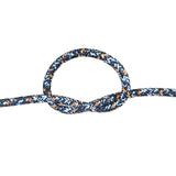 A close-up of a braided rope tied in a loop and knot, shown against a plain white background. The rope has a black base with a white chevron pattern and small orange diamond accents.