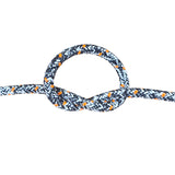 A close-up of a braided rope tied in a loop and knot, shown against a plain white background. The rope has a black base with a white chevron pattern and small orange diamond accents.