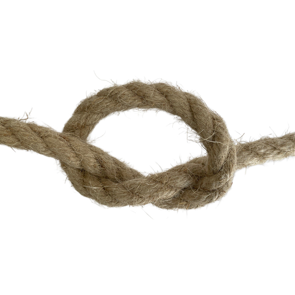 Close-up of a knotted piece of natural;brown rope on a white background