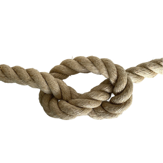 Natural brown rope in a knot on a white background