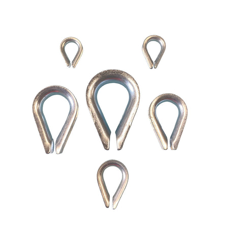 A selection of 3mm to 12mm galvanised rope thimbles on a white background. 