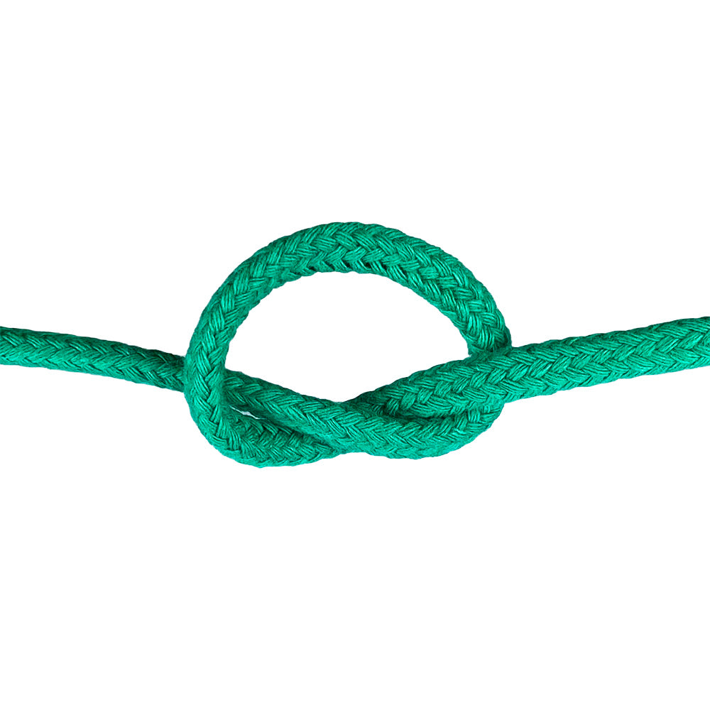 Close-up of 6mm green magcians cord in a knot with a white background