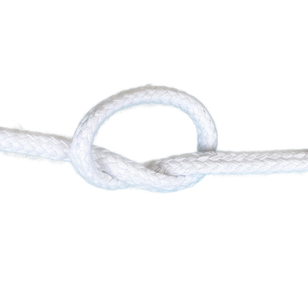 Close-up of 12mm white magcians cord in a knot with a white background