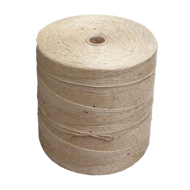 Roll of jute twine with a cardboard centre on a white background
