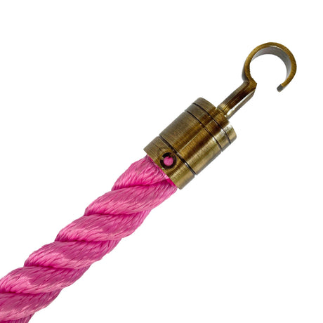 Pink rope with a brass hook on a white background