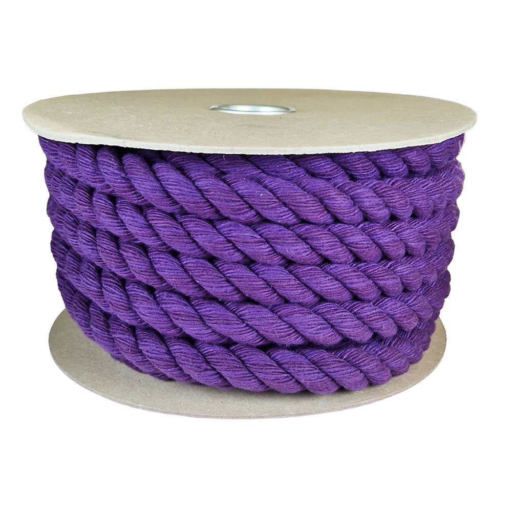 spool of purple barrier rope on a cardboard reel against a wheet background