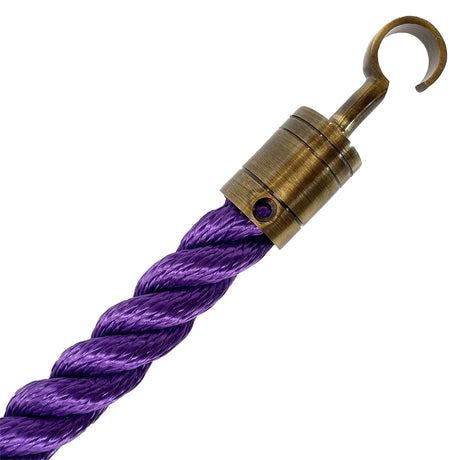 Purple rope with a brass hook on a white background
