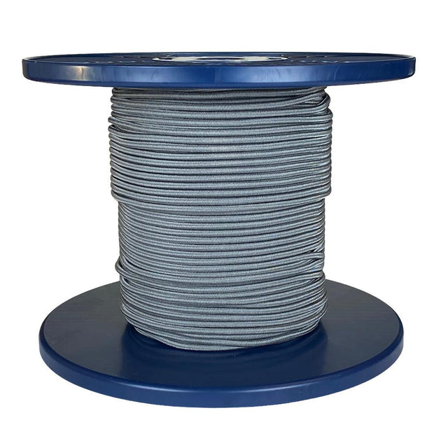 Spool of grey shock cord on a blue plastic reel with a white background