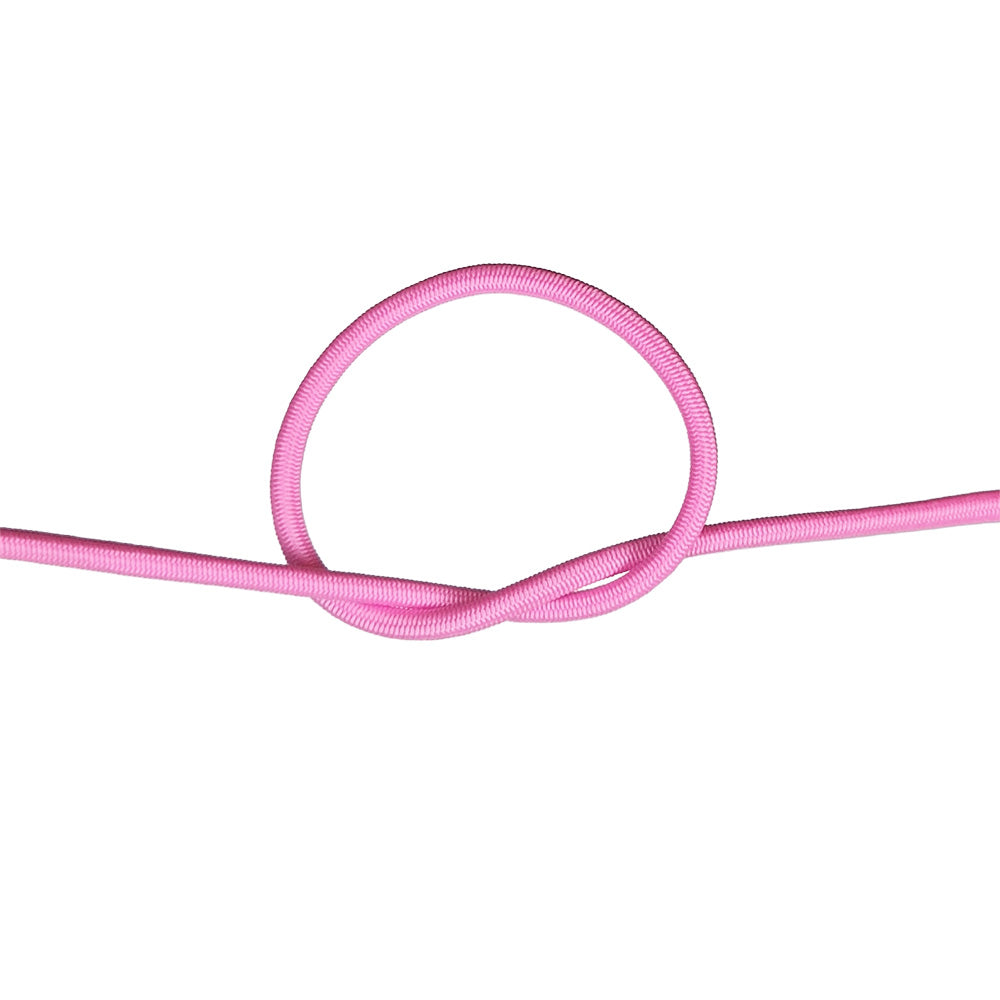Close-up of pink bungee cord in a knot on a white background