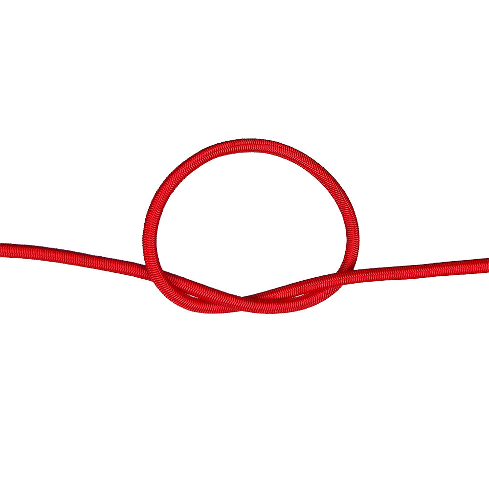 Close-up of red bungee cord in a knot on a white background