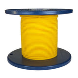 Spool of yellow shock cord on a blue plastic reel with a white background