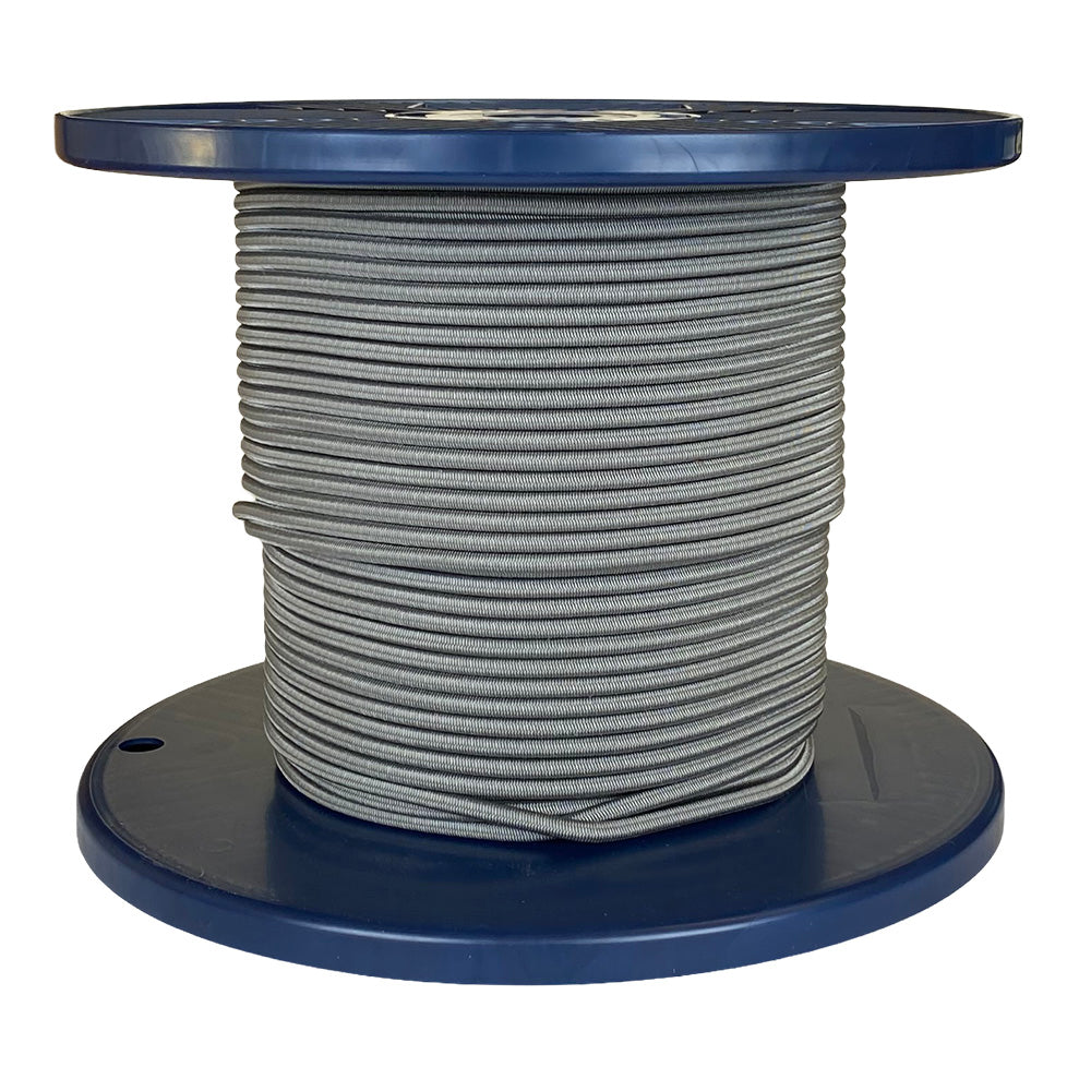 Spool of grey shock cord on a blue plastic reel with a white background