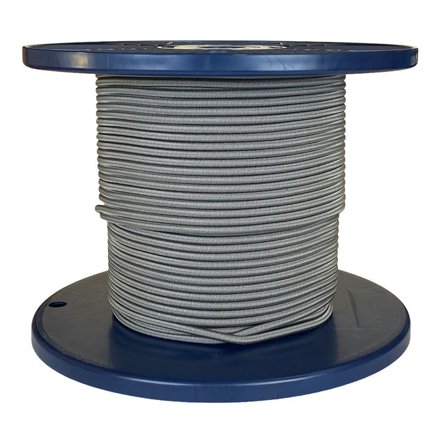 Spool of grey shock cord on a blue plastic reel with a white background
