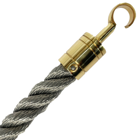 Gold hook attached to a grey rope on a white background