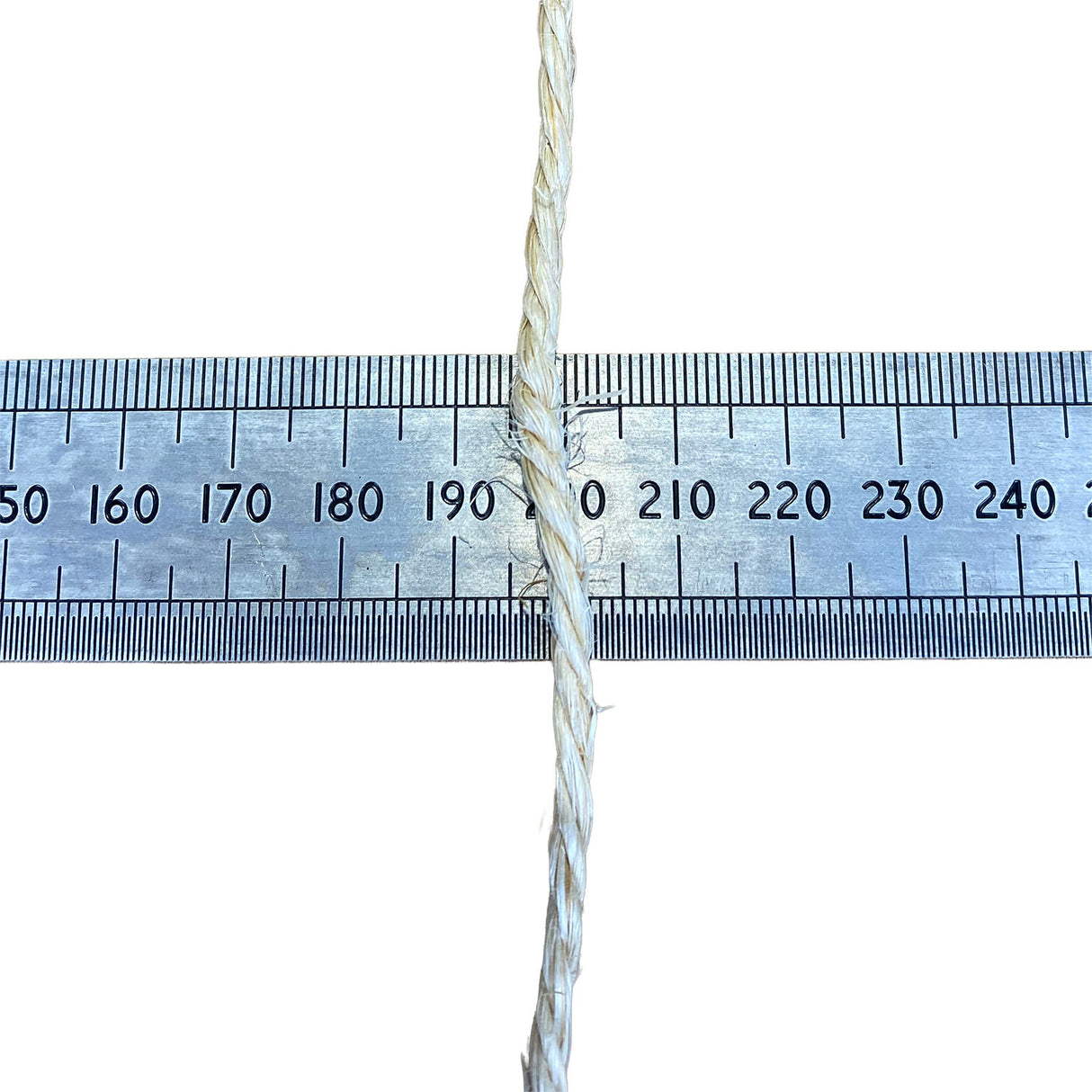 A close-up of a sisal rope, running vertically down the centre of a metal ruler on a white background, to show thickness.