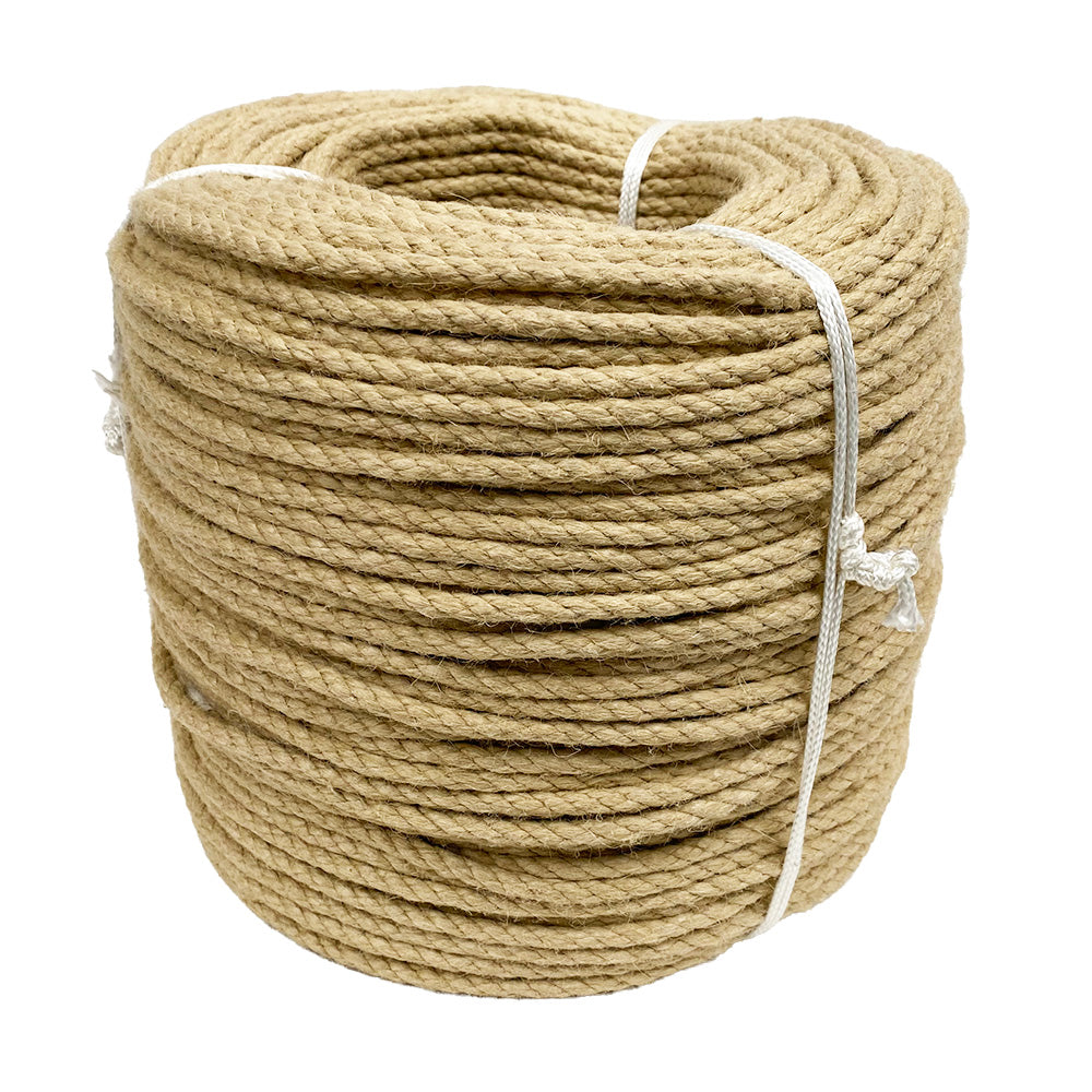 Coil of natural coloured synthetic hemp rope on a white background