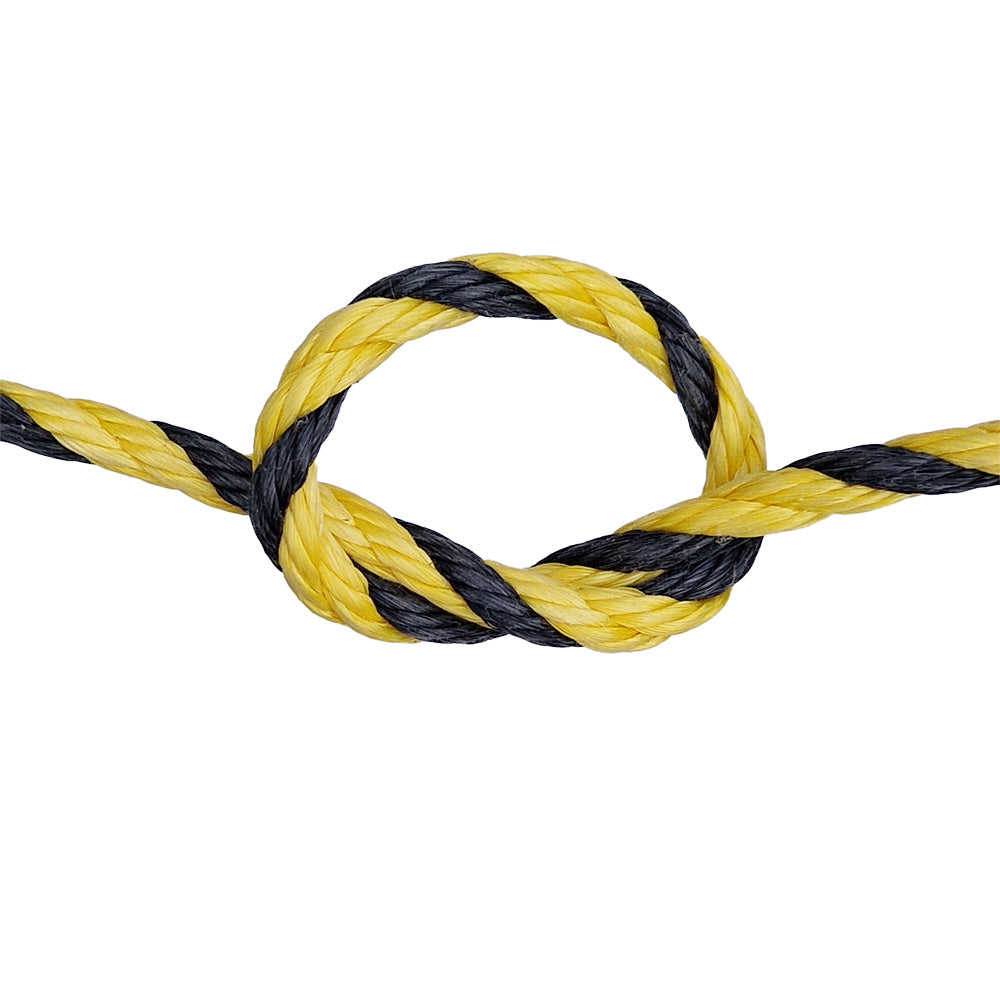 Close-up of a yellow and black rope with a knot on a white background