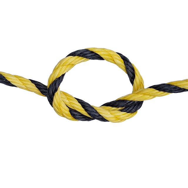 Close-up of a yellow and black rope with a knot on a white background