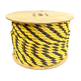 Spool of yellow and black striped rope on a white background