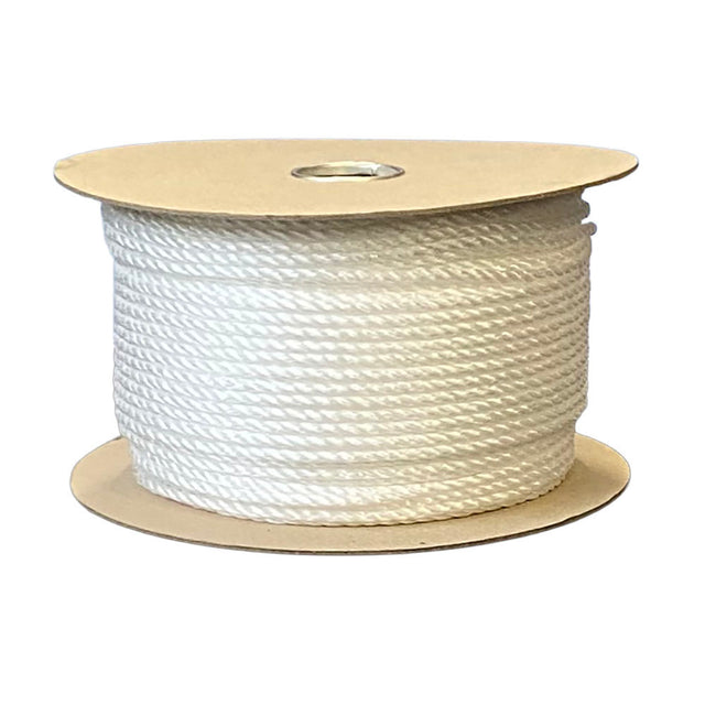 Spool of white rope on a cardboard reel with a white background