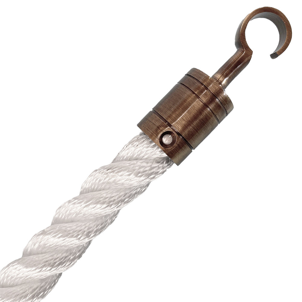 White rope with a brass metal hook on a white background