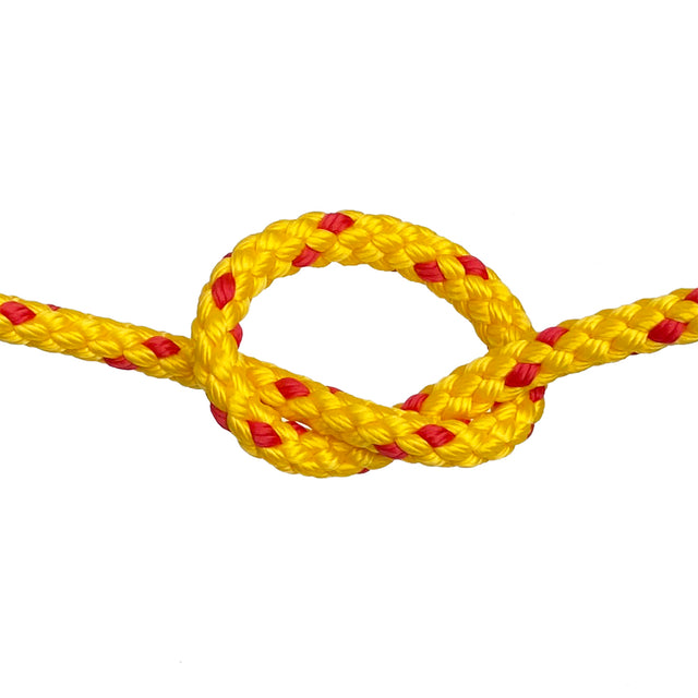 Yellow rope with red accents tied in a knot on a white background