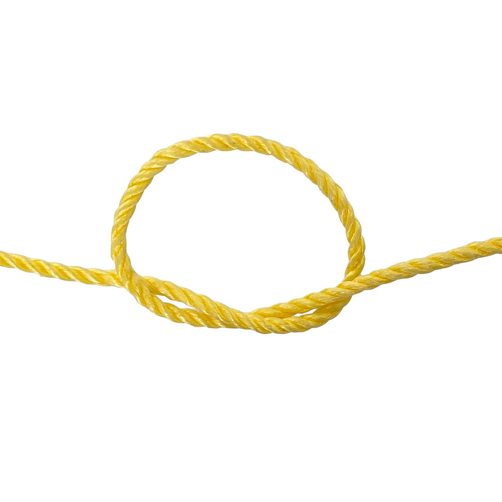 Yellow rope in a knot on a white background