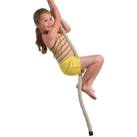 A young girl with blonde hair in a ponytail is climbing a thick, light beige rope. She is wearing a striped tank top and yellow shorts, posed against a solid white background.