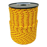 Spool of yellow rope with red accents on a white background