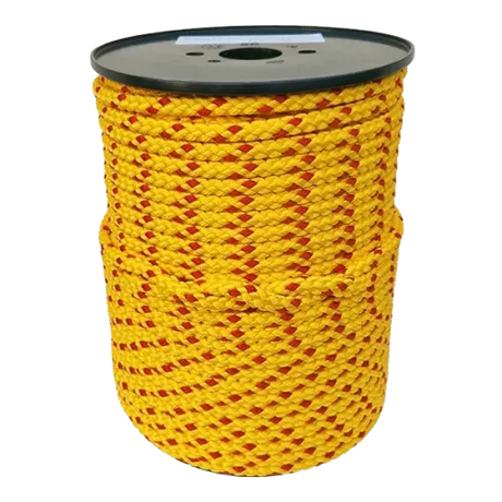 Spool of yellow rope with red accents on a white background